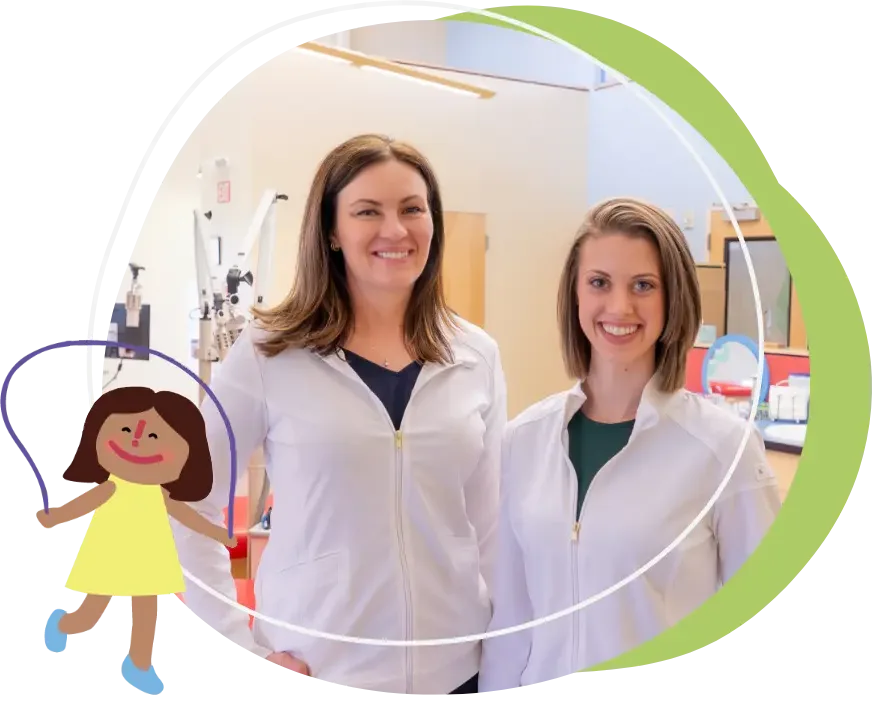 Two women in white lab coats stand and smile in a laboratory setting, with scientific equipment visible behind them. An illustrated drawing of a child in a yellow dress is added to the left side of the image.